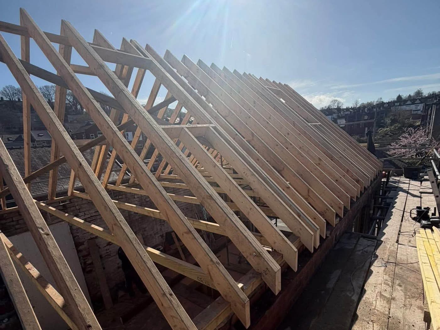 Roof stripped back to bare rafters before re-covering